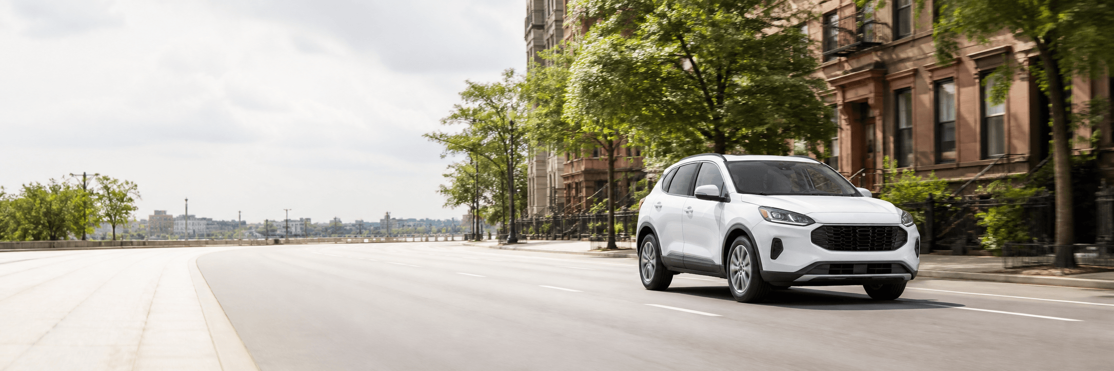SUV driving on a city avenue